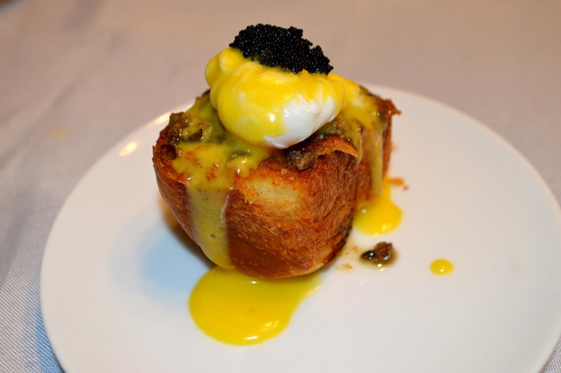 Brioche Crostini with Poached Quail Egg, Caviar, Handmade Hollandaise, and Foie Gras Pate